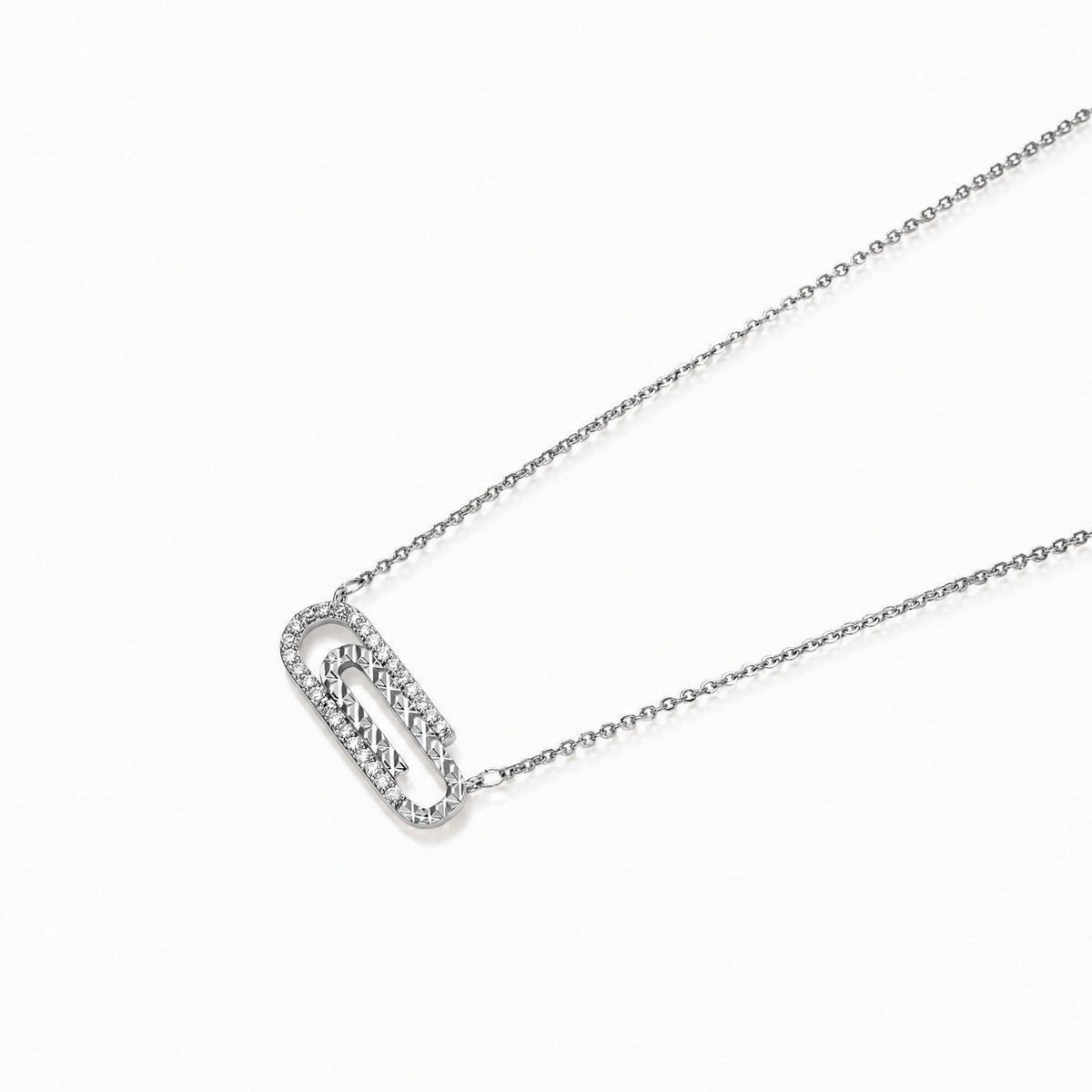 White gold plated necklace with dual-frame geometric pendant featuring crystal pavé border on pale background.