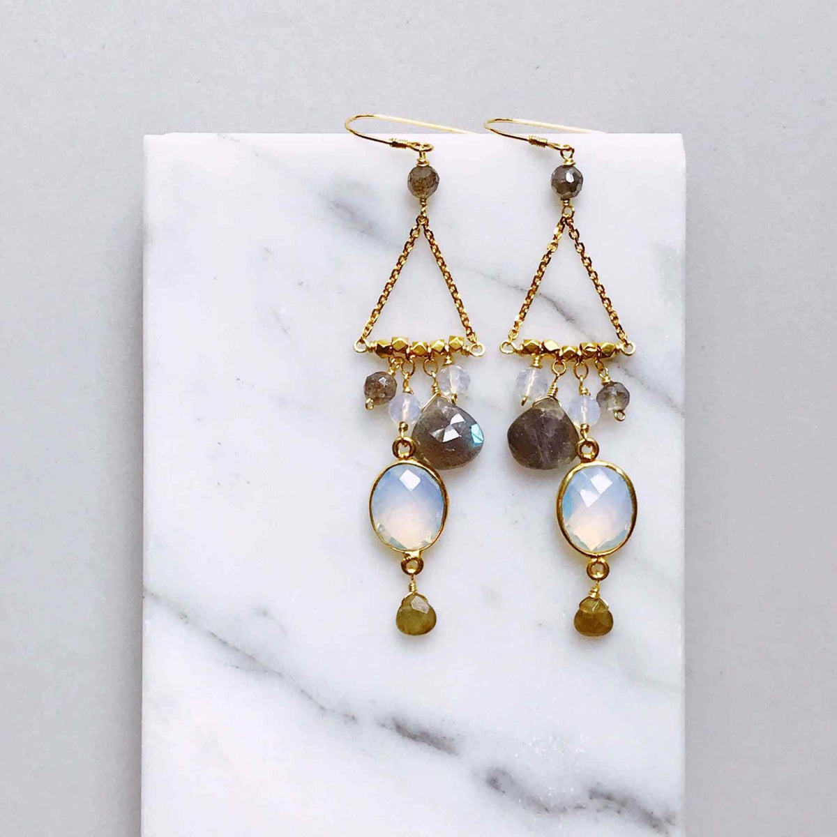 Opalite Chandie EarringsOur "chandies" are a modern take on classic chandelier earrings, using gemstone color combos and varying stone shapes and sizes. This pair features bezel set opal quEarringsPARKEN JEWELRYVettedArcOpalite Chandie Earrings