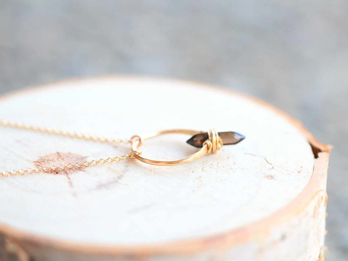 Smoky quartz crest necklace with faceted brown gemstone pendant on chain