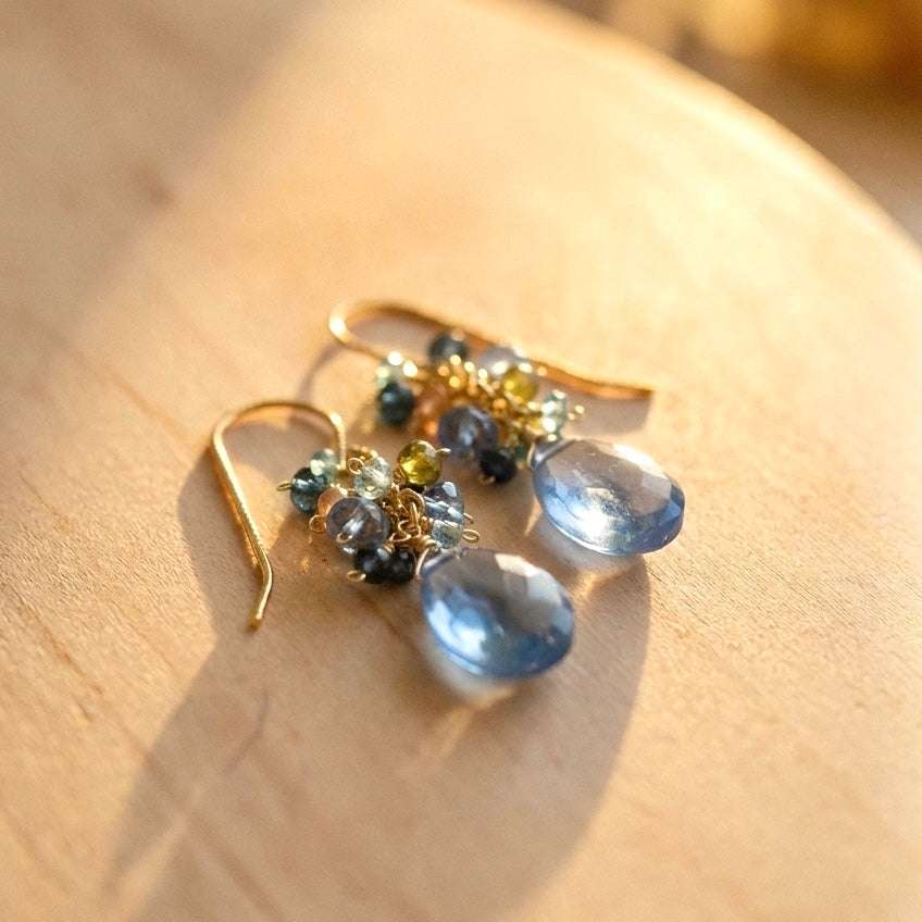 Sky Blue Quartz Bala EarringsStunning drops of color. Gold drop earrings made with sky blue quartz topped with a blue cluster of gems.
- 1.25" long- French hooks- 14k gold plated .925 fine ItaliEarringsPARKEN JEWELRYVettedArcSky Blue Quartz