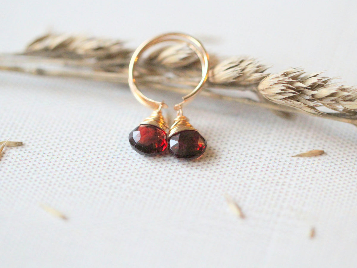 Garnet dangle huggie earrings with deep red gemstone drops, small hoop earrings for everyday wear