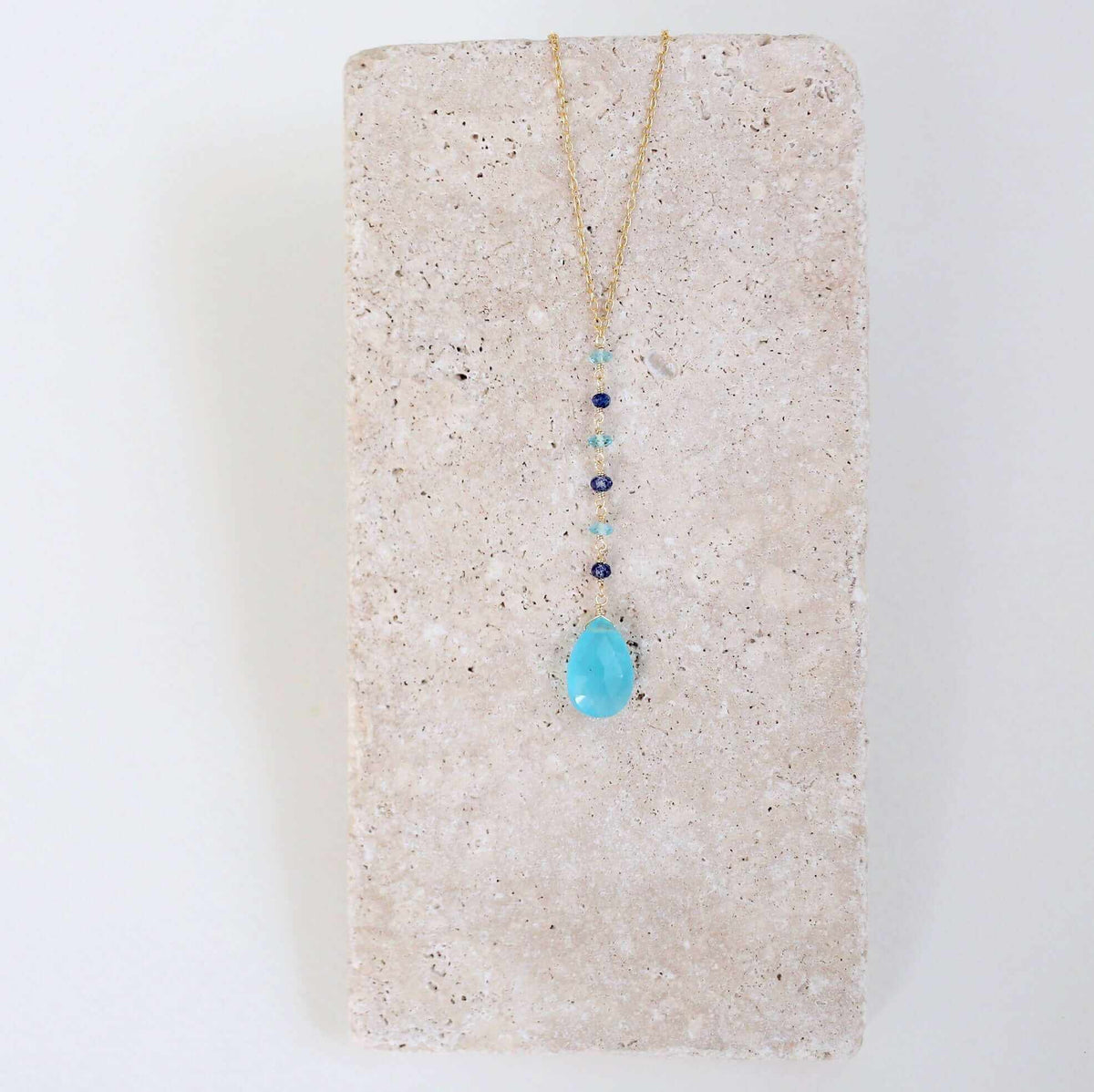 Blue Chalcedony Yoga PendantYoga pendants are designed for total simplicity.
- Blue Chalcedony gemstones paired with shades of blue gemstone accent stones- 18-20" long with a 2" extender chain-NecklacesPARKEN JEWELRYVettedArcBlue Chalcedony Yoga Pendant