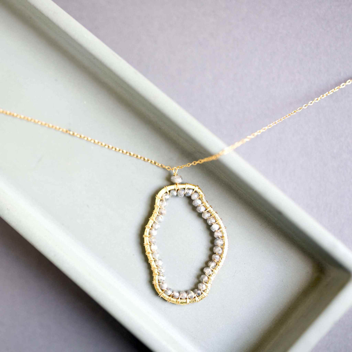 Labradorite Freestyle Jewelry SetCompletely one-of-a-kind, Labradorite gold pendant and earrings set. Each one is a unique, amorphous shape.
Floating pendant is strung on a very delicate chain that Necklace/Earring KitPARKEN JEWELRYVettedArcLabradorite Freestyle Jewelry Set