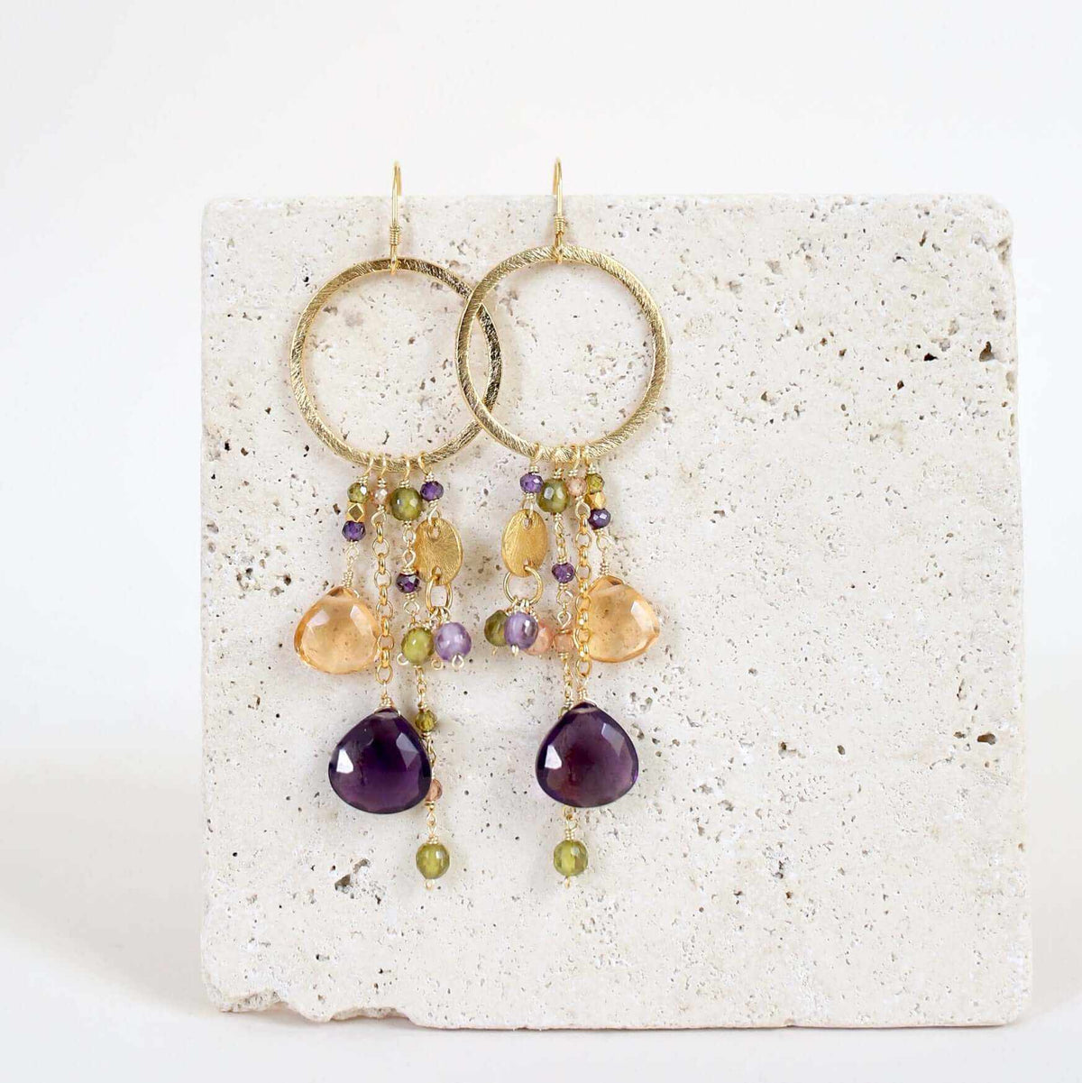 Iolite & Aquamarine Ammil EarringsMultiple strands of lush gems sparkle on a 1" hoop.
- Aquamarine Quartz and Iolite gemstones- 3.5" long- French hooks- 14k gold plated .925 fine Italian sterling silEarringsPARKEN JEWELRYVettedArcIolite & Aquamarine Ammil Earrings