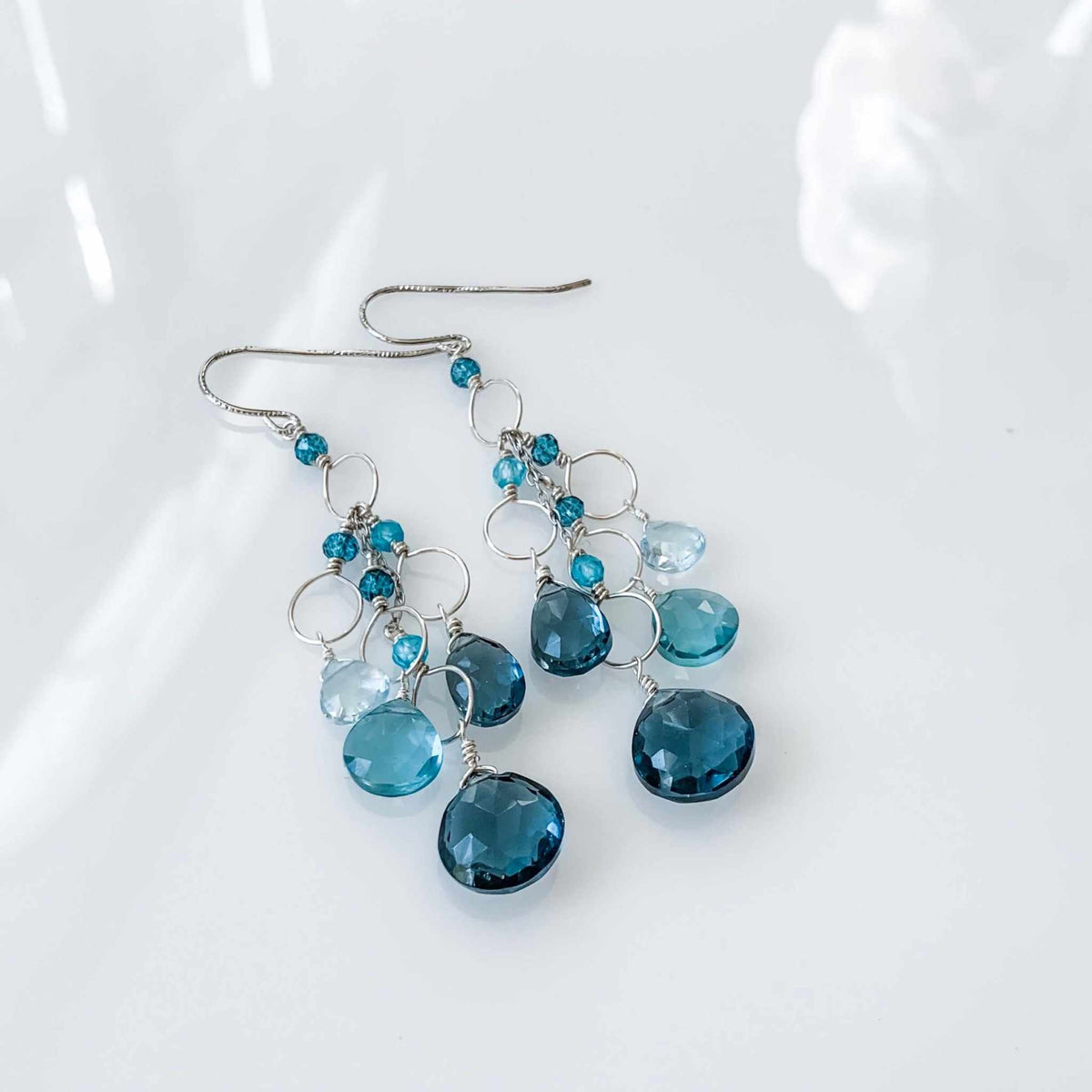 Iolite & Aquamarine Gold Waterfall EarringsElegant Iolite & Aquamarine Gold Waterfall Earrings feature a unique tiered chandelier earring design, set in 14k gold plated over fine .925 Italian sterling silEarringsPARKEN JEWELRYVettedArcIolite & Aquamarine