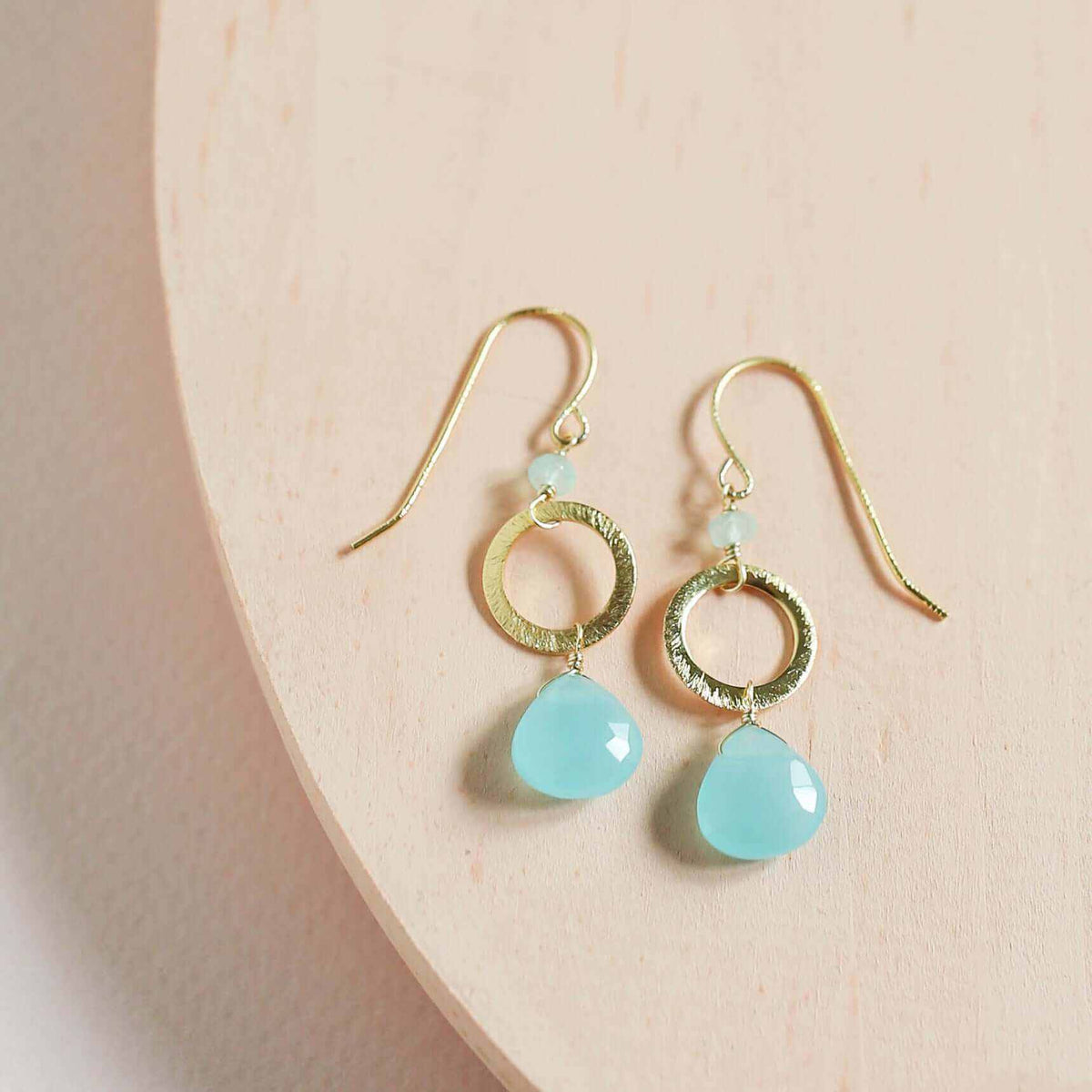 The Airie Earring featuring blue chalcedony gemstones with rhodium plated sterling silver and French hooks