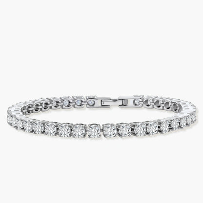 Sterling silver tennis bracelet with continuous row of brilliant moissanite stones and secure clasp closure on cream background.