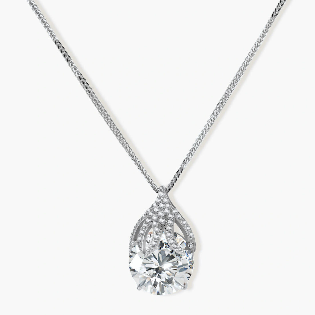 Sterling silver necklace featuring a large pear-shaped moissanite stone in an ornate setting with smaller accent stones