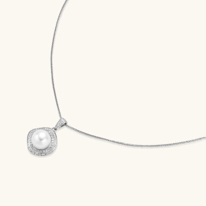 Cushion-shaped double halo pendant with 10mm freshwater pearl center on rhodium-plated sterling silver chain