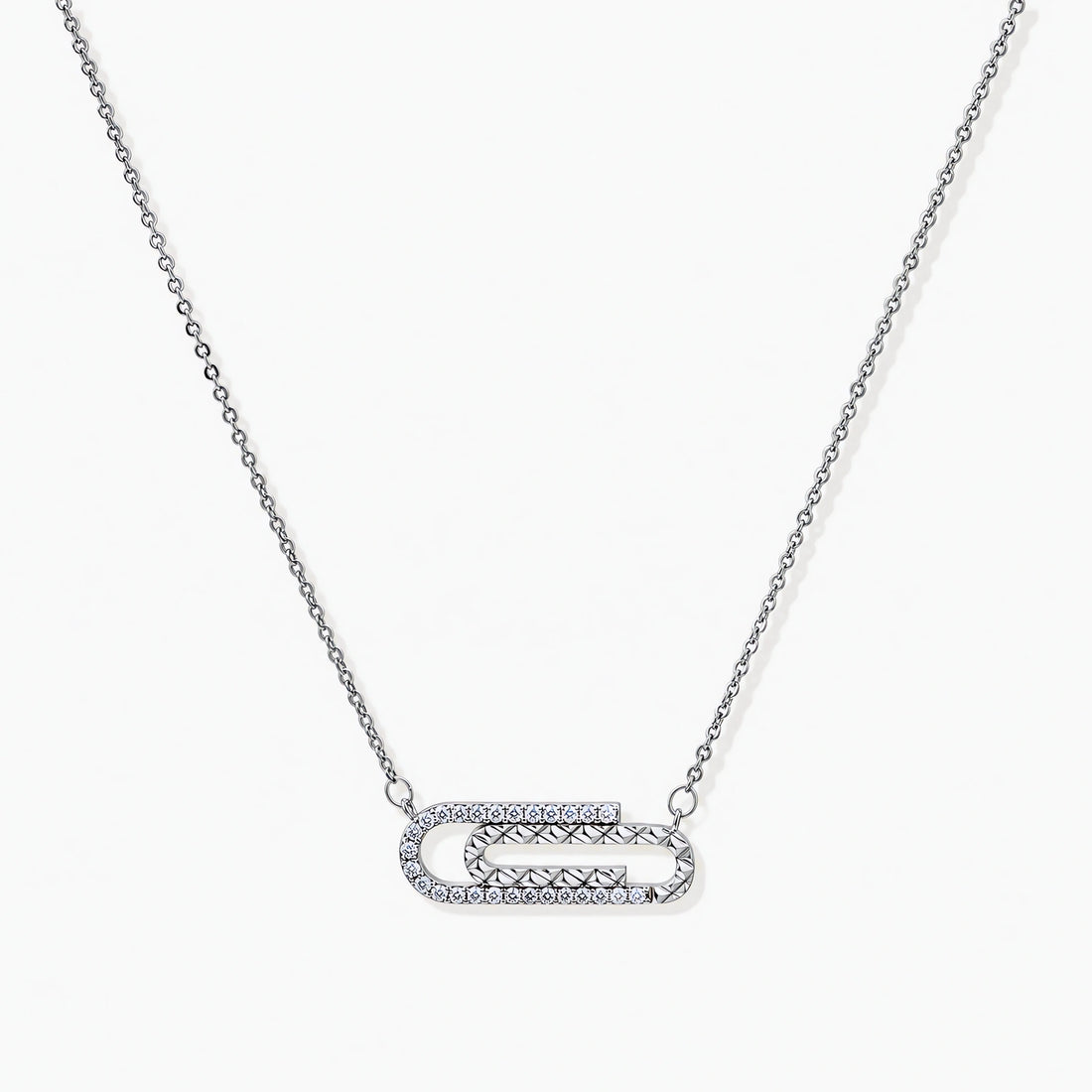 White gold plated necklace with dual-frame geometric pendant featuring crystal pavé border on pale background.