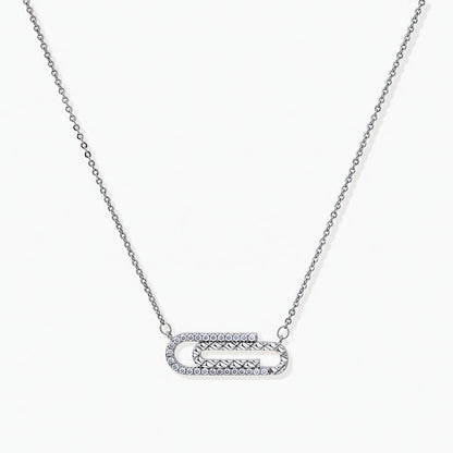 White gold plated necklace with dual-frame geometric pendant featuring crystal pavé border on pale background.