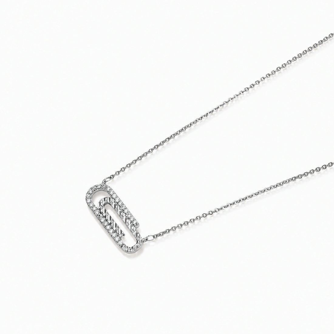White gold plated necklace with dual-frame geometric pendant featuring crystal pavé border on pale background.