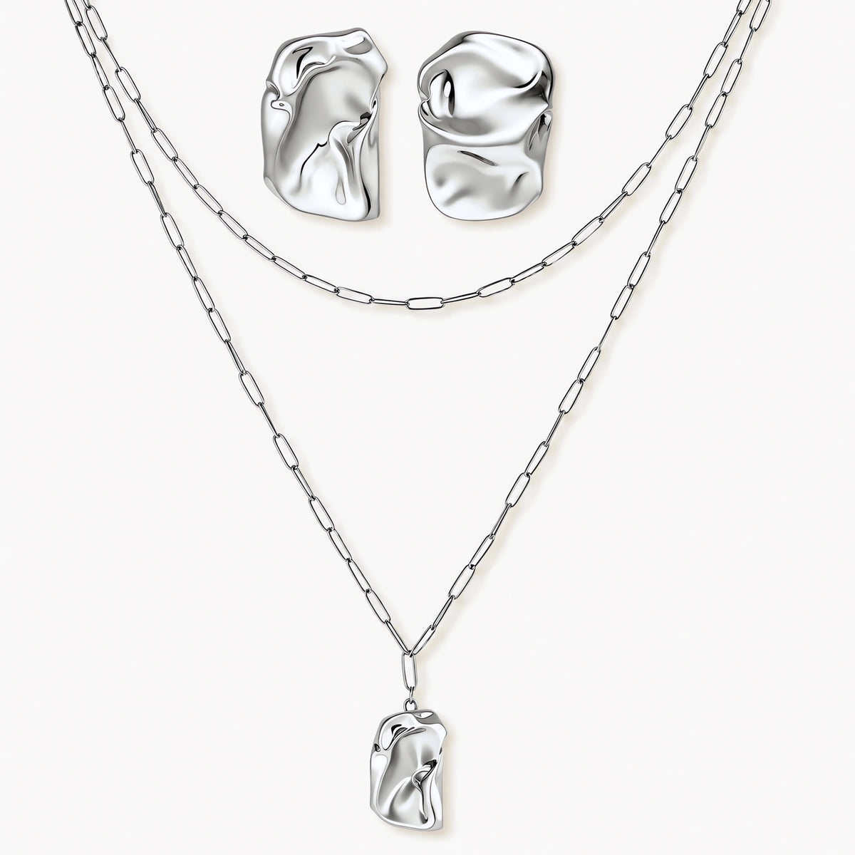 Modern textured hoop earrings and layered chain necklace with liquid metal pendant in silver and gold finishes.