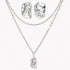 Modern textured hoop earrings and layered chain necklace with liquid metal pendant in silver and gold finishes.