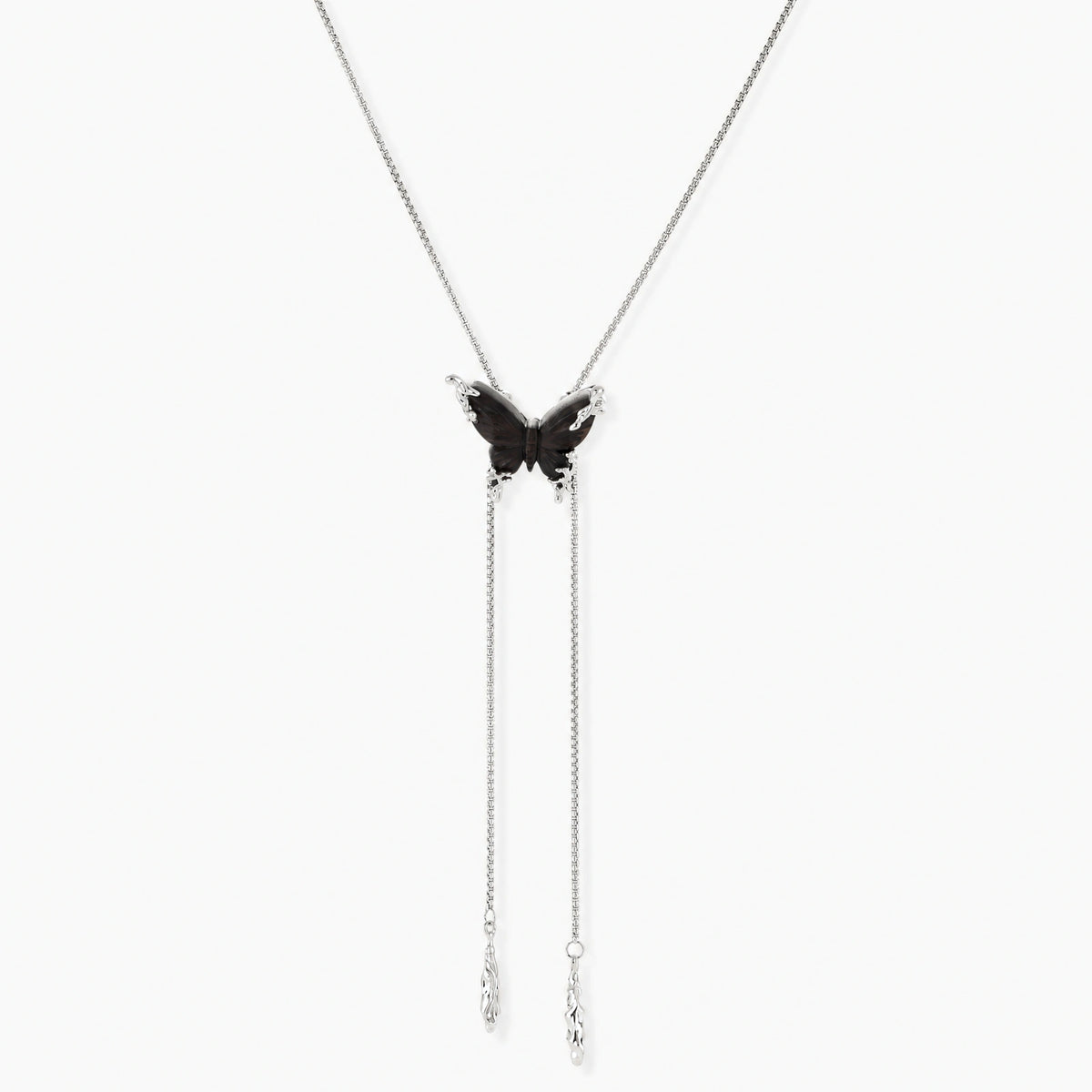 Dark wood butterfly earrings and necklace with silver chain accents on white background, showing natural grain texture.