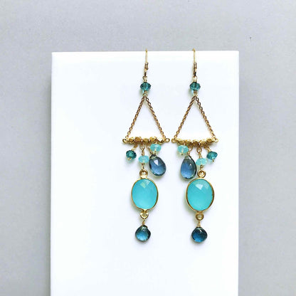 Blue Chandie EarringsOur "chandies" are a modern take on classic chandelier earrings, using gemstone color combos and different stone shapes and sizes.
- Bezel set blue chalcedony gemstoEarringsPARKEN JEWELRYVettedArcBlue Chandie Earrings