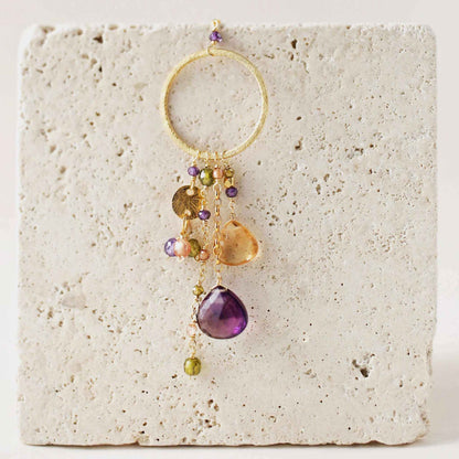 The Ammil Necklace - Amethyst &amp; CitrineThe ultimate gemstone pendant. Multiple strands of glimmering amethyst, citrine and peridot gemstones hang from our signature gold circle. Handmade with 14k gold plaNecklacesPARKEN JEWELRYVettedArcThe Ammil Necklace