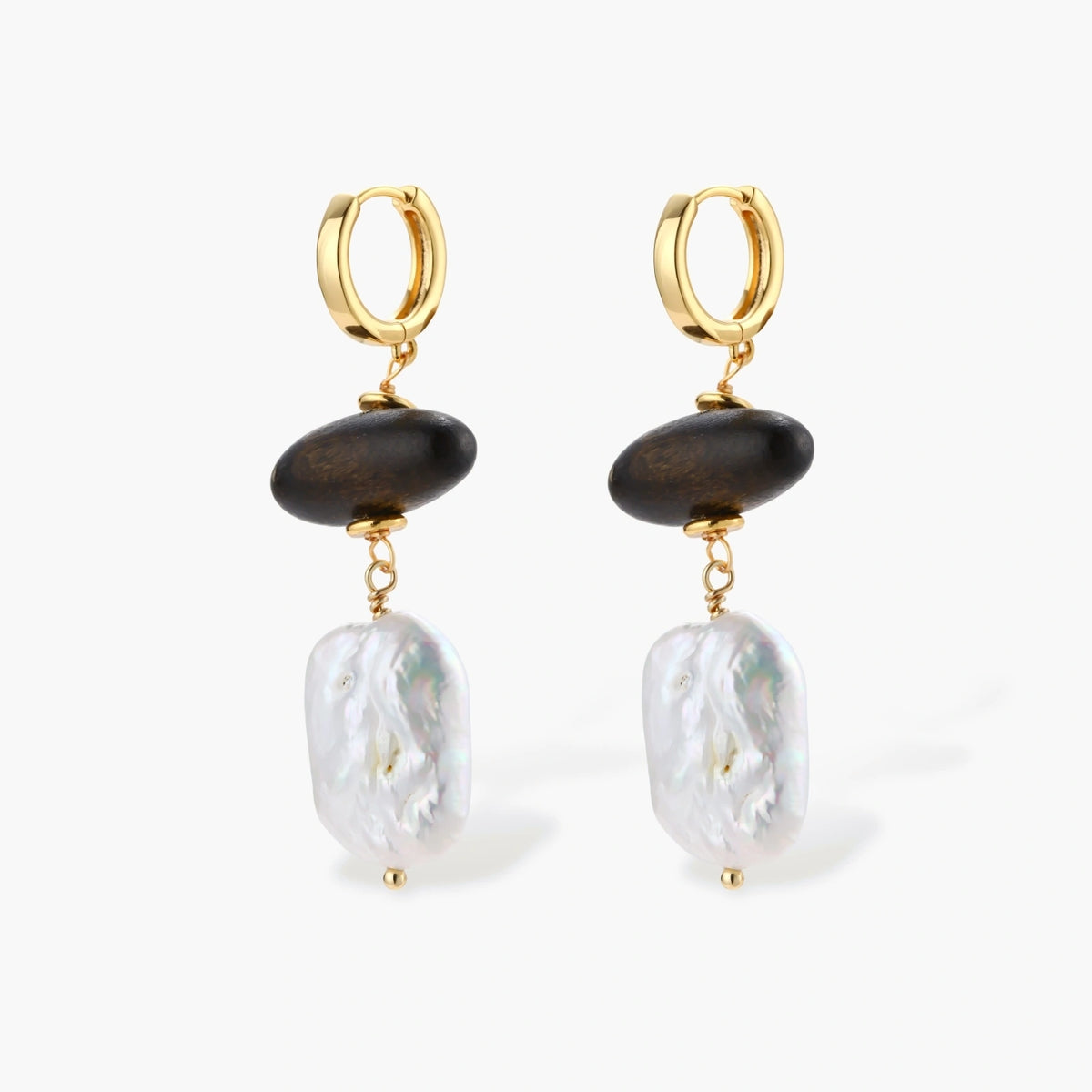 Gold hoop earrings with dark wood beads and baroque freshwater pearls, shown from multiple angles on cream background.