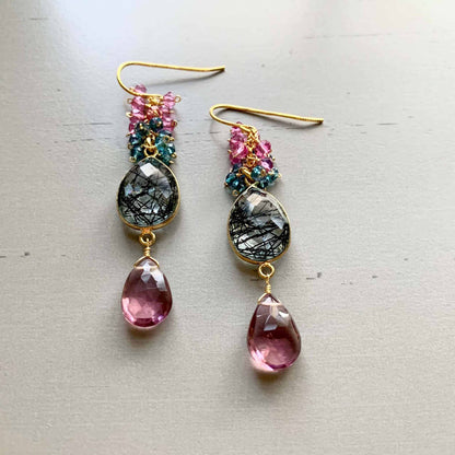 Pink Rhodolite Garnet And Rutilated Quartz Bezel Cluster EarringsGauranteed to get attention, these long gemstone drop earrings are made with dazzling pink rhodolite garnet gems and black rutilated quartz bezel stones.- 2.5" long-EarringsPARKEN JEWELRYVettedArcPink Rhodolite Garnet