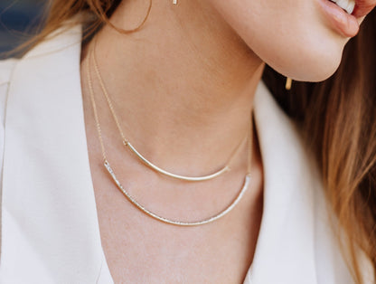 Modern bar choker necklace shown on a neck, thin gold bar pendant for a minimalist layered look