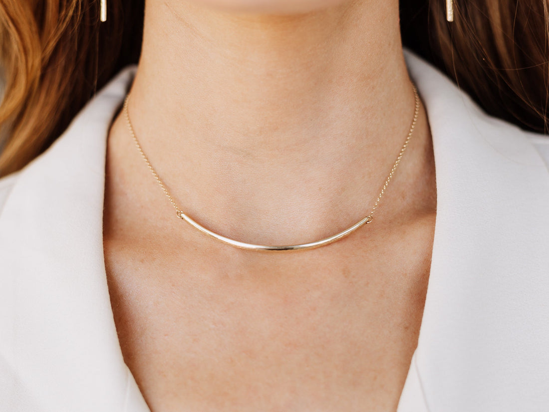 Modern bar choker necklace with a sleek horizontal bar pendant on a delicate chain