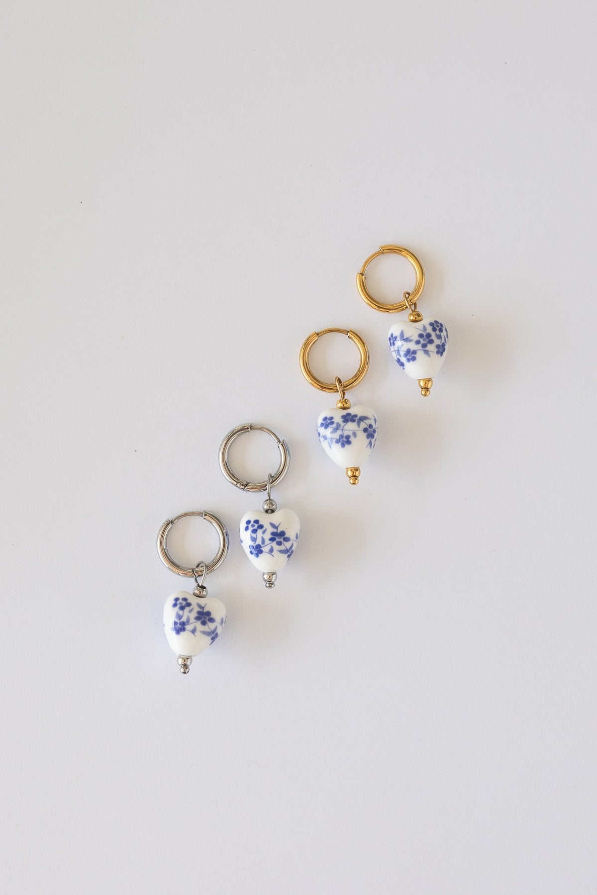 Single blue hoop earring with a clean, minimal design