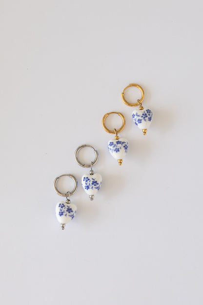 Single blue hoop earring with a clean, minimal design