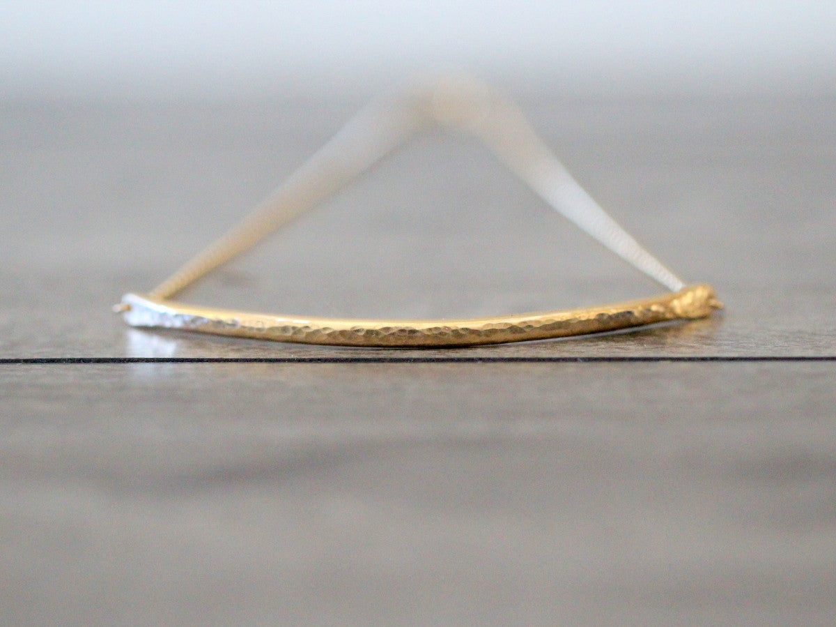 Sleek bar choker necklace detail shot, smooth metal bar pendant on a slim chain
