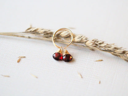 Pair of garnet dangle hug earrings, tiny gold hoops with dangling red garnet stones