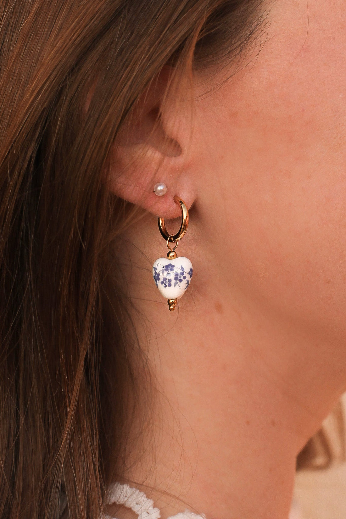 Pair of blue hoop earrings with a smooth circular design