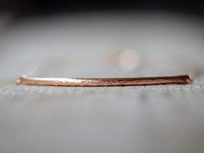 Close-up of a polished bar choker necklace, simple contemporary design for daily wear