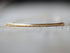 Modern bar choker necklace with a sleek horizontal bar pendant on a delicate chain