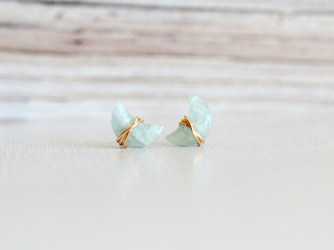 Aquamarine stud earrings featuring moonbeam and stardust detailing