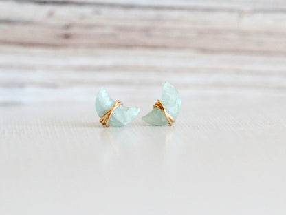 Aquamarine stud earrings featuring moonbeam and stardust detailing