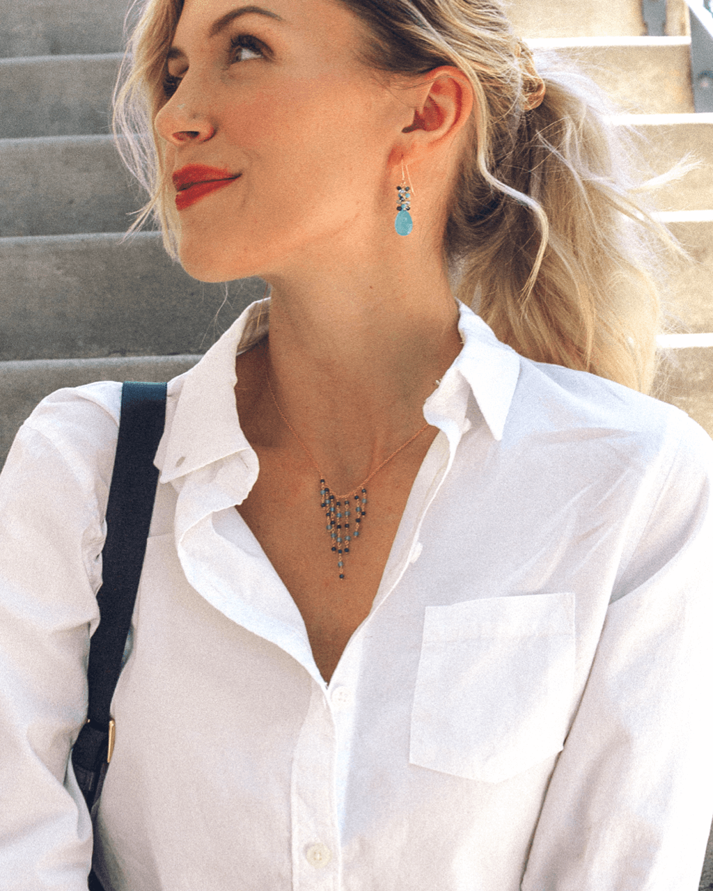 Blue Gemstone Fringe Necklace &amp; Earring SetWe paired our delicate gemstone fringe necklace with a beautiful gemstone cluster earring.
Fringe Necklace is made with Iolite and Blue Apatite gemstones- 16-18" lonNecklace/Earring KitPARKEN JEWELRYVettedArcBlue Gemstone Fringe Necklace