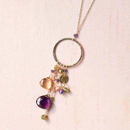 The Ammil Necklace - Amethyst &amp; CitrineThe ultimate gemstone pendant. Multiple strands of glimmering amethyst, citrine and peridot gemstones hang from our signature gold circle. Handmade with 14k gold plaNecklacesPARKEN JEWELRYVettedArcThe Ammil Necklace