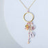 The Ammil Necklace with rose pink gemstones and gold hoop pendant