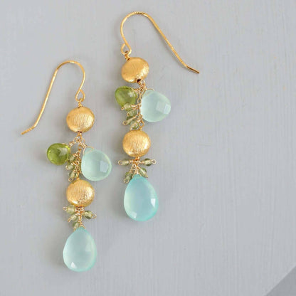 Aqua Chalcedony &amp; Peridot Gold Drop EarringsGorgeous aqua chalcedony gemstone drop earrings. Made with aqua chalcedony and peridot gemstones.- 2.5" long- French hooks- 14k gold plated .925 fine Italian sterlinEarringsPARKEN JEWELRYVettedArcAqua Chalcedony &amp; Peridot