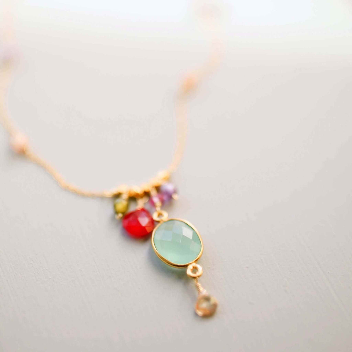 Aqua chalcedony rainbow bezel necklace with gold chain and multicolored gemstone accents