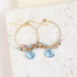 Aquamarine quartz swing earrings in gold vermeil with delicate motion and vibrant aqua blue gemstones