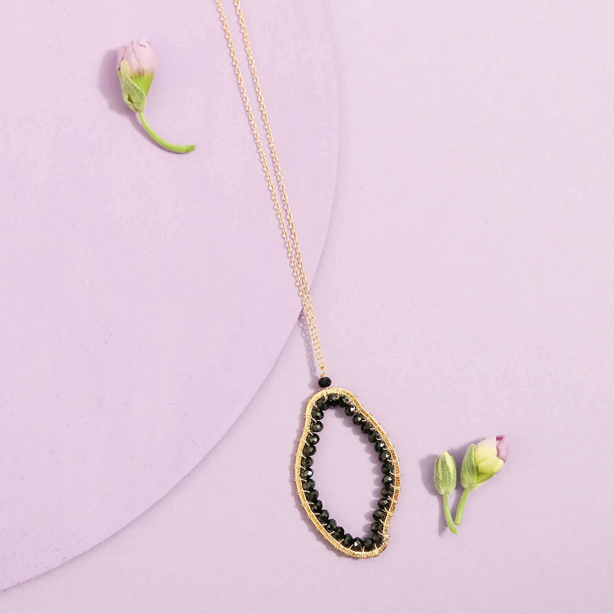 Black Spinel pendant necklace with unique abstract shape on delicate 14k gold plated sterling silver chain