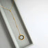 Black Spinel pendant with rainbow gemstones and pearl on a 14k gold plated Y necklace