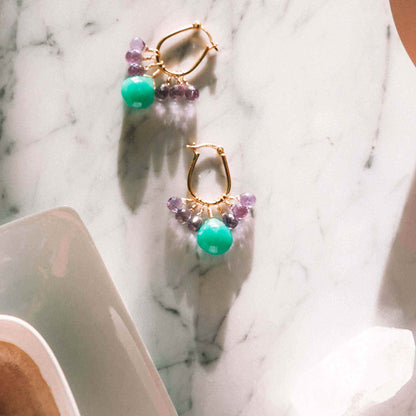 Chrysoprase &amp; Amethyst Gold EarringsWe loved the bright sea green color of chrysoprase gemstones the minute we set eyes on them. Paired with sparkling amethyst, and so lightweight you&