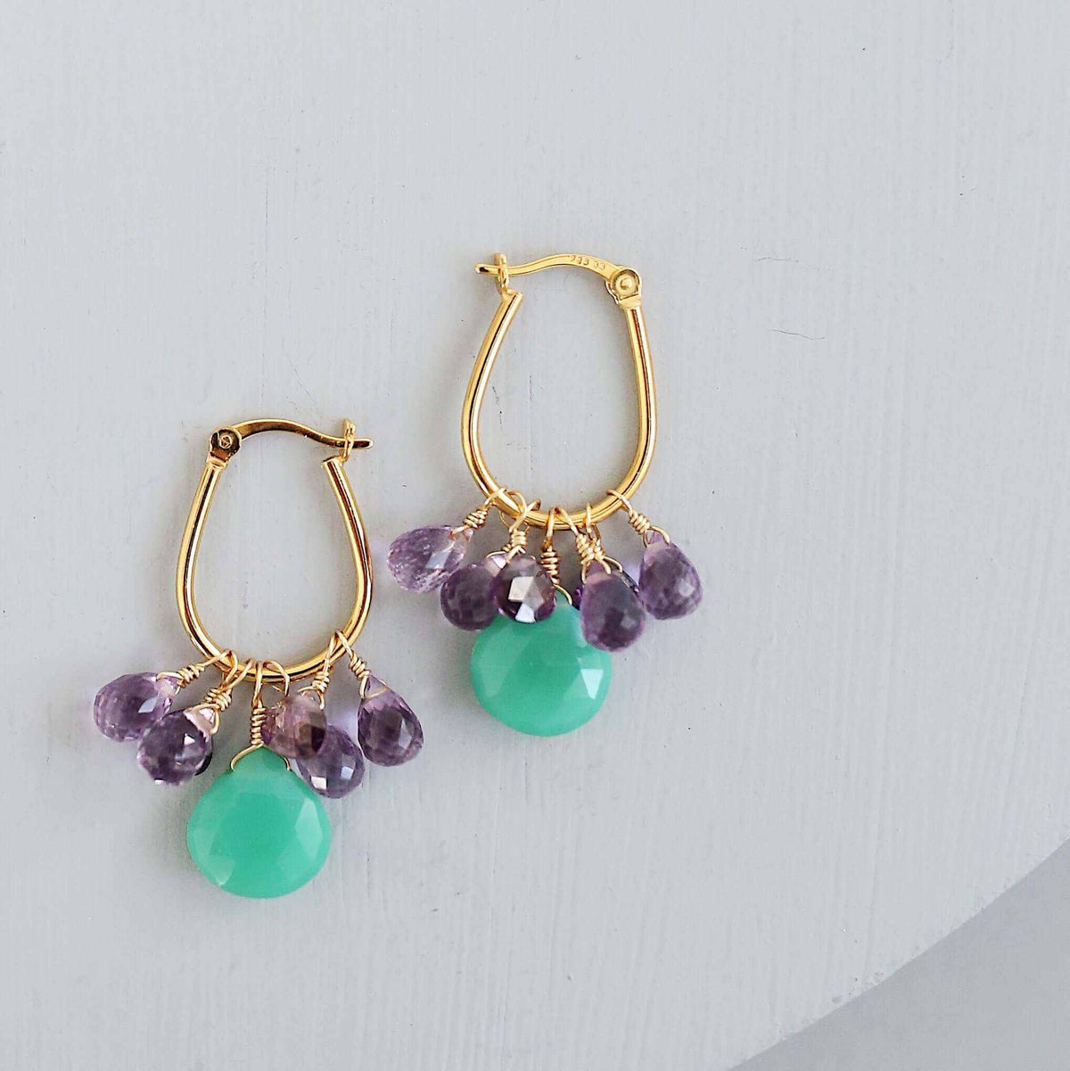 Chrysoprase &amp; Amethyst Gold EarringsWe loved the bright sea green color of chrysoprase gemstones the minute we set eyes on them. Paired with sparkling amethyst, and so lightweight you&