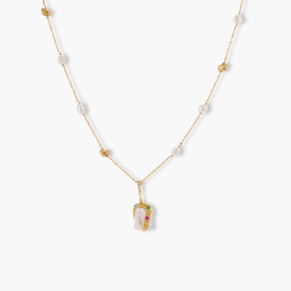 Delicate 18k gold-plated chain with baroque pearls and colorful enamel pendant featuring blue, pink accents on cream background.