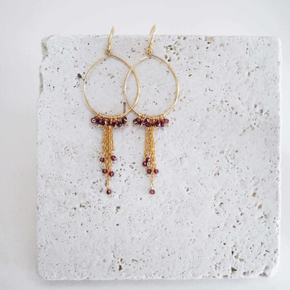 Garnet Mini Swing Hoop Earrings with delicate chains, 14k gold plated sterling silver, and garnet gemstones