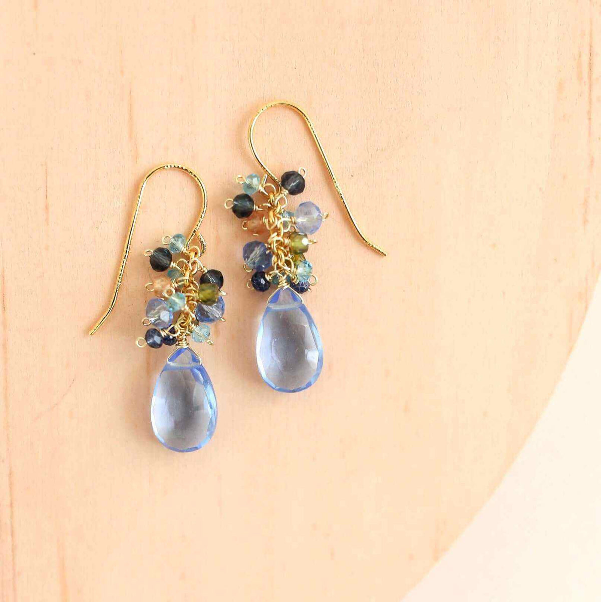 White Chalcedony Bala EarringsShimmering white stones topped with a rainbow cluster of gems.
- 1.25" long- French hooks- 14k gold plated .925 fine Italian sterling silver- Made in the USA in our EarringsPARKEN JEWELRYVettedArcWhite Chalcedony Bala Earrings