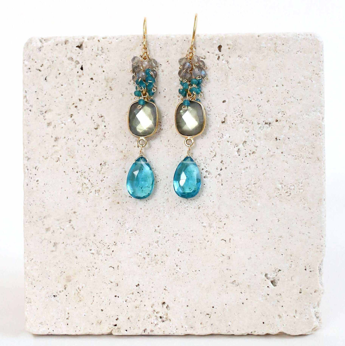 Labradorite Bezel Cluster EarringsDripping in gems, these long gemstone drop earrings are made with a labradorite bezel and neon blue quartz gemstones.- 2.5" long- French hooks
- 14k gold plated fineEarringsPARKEN JEWELRYVettedArcLabradorite Bezel Cluster Earrings