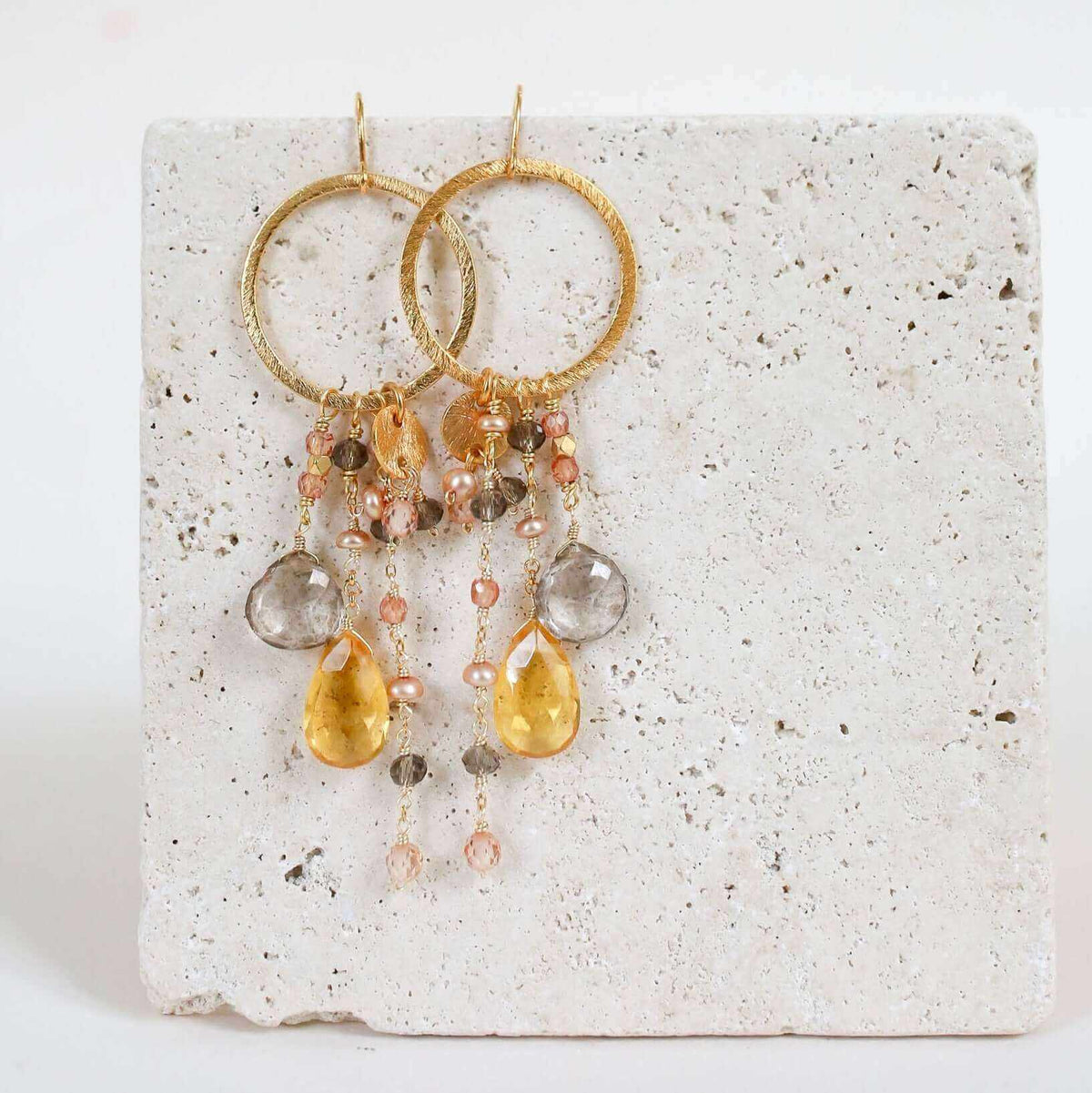 Rose Pink Gemstones Ammil EarringsMultiple strands of lush gems sparkle on a 1" hoop.
- Pink Clear Quartz and Pink Tourmaline gemstones- 3.5" long- French hooks- 14k gold plated .925 fine Italian steEarringsPARKEN JEWELRYVettedArcRose Pink Gemstones