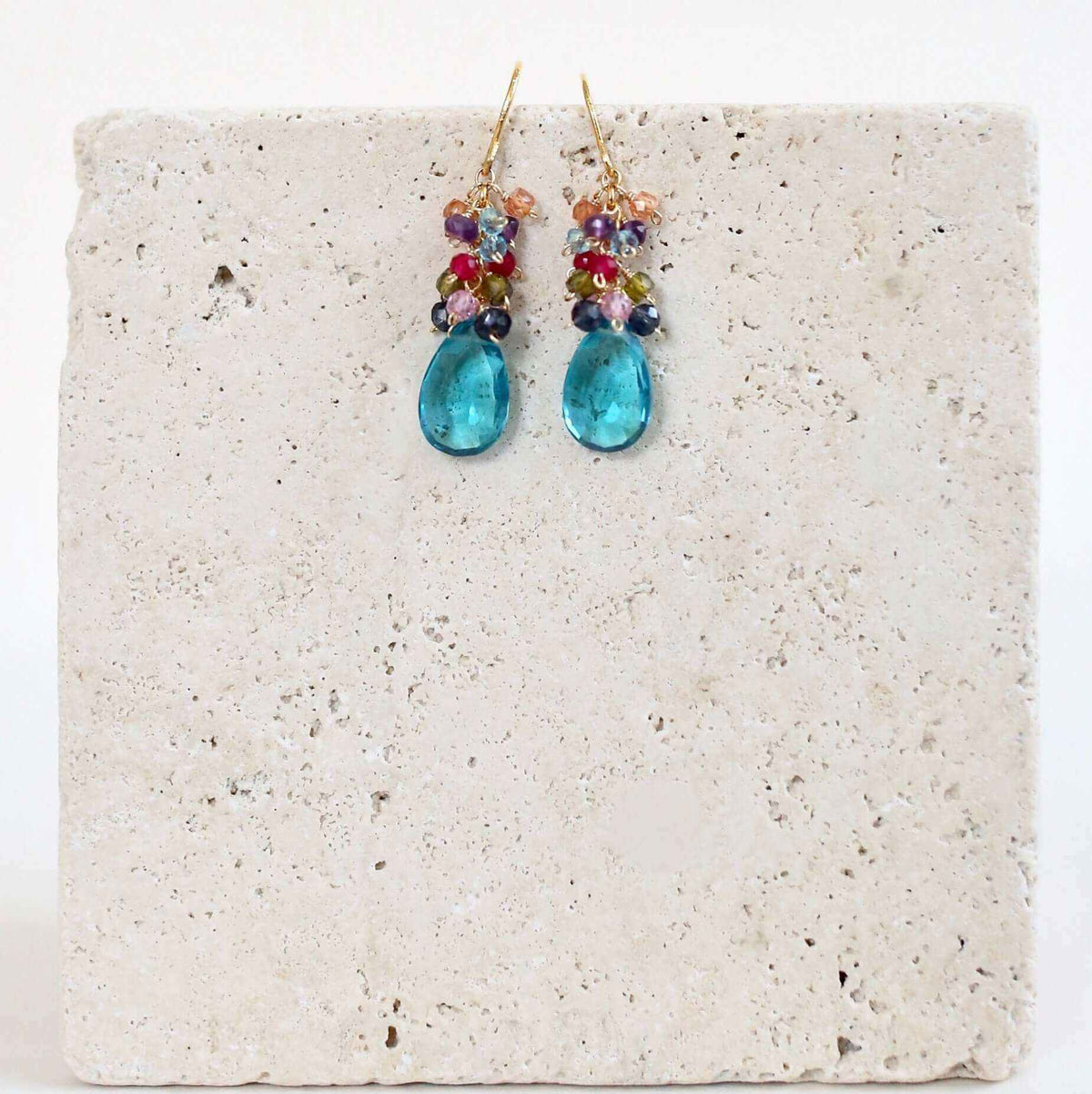 Neon Blue Quartz Bala EarringsStunning drops of color. Gold drop earrings made with neon blue quartz topped with a rainbow cluster of gems.
- 1.25" long- French hooks- 14k gold plated .925 fine IEarringsPARKEN JEWELRYVettedArcNeon Blue Quartz